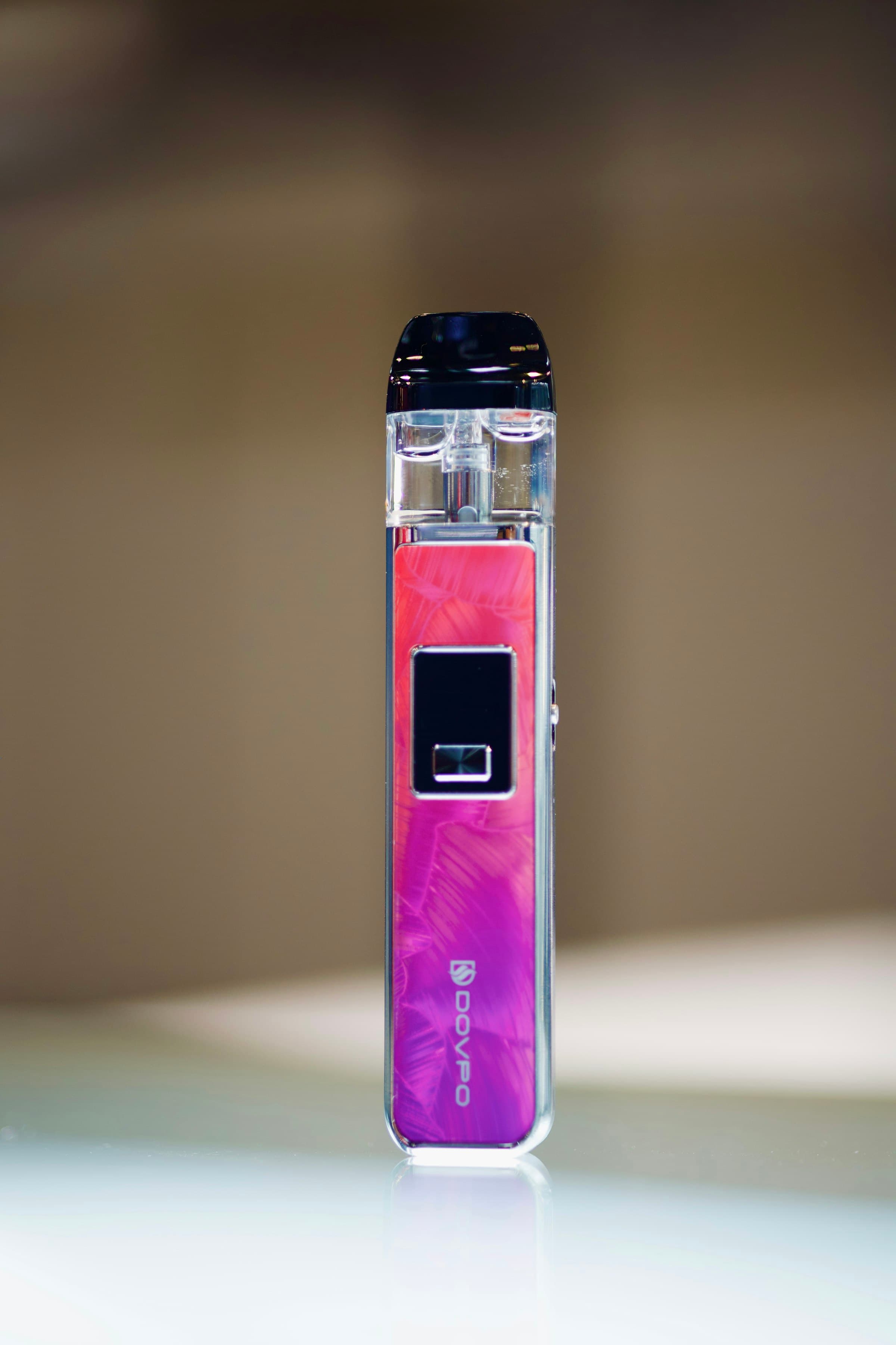 A rechargeable pod vape kit sitting on a table